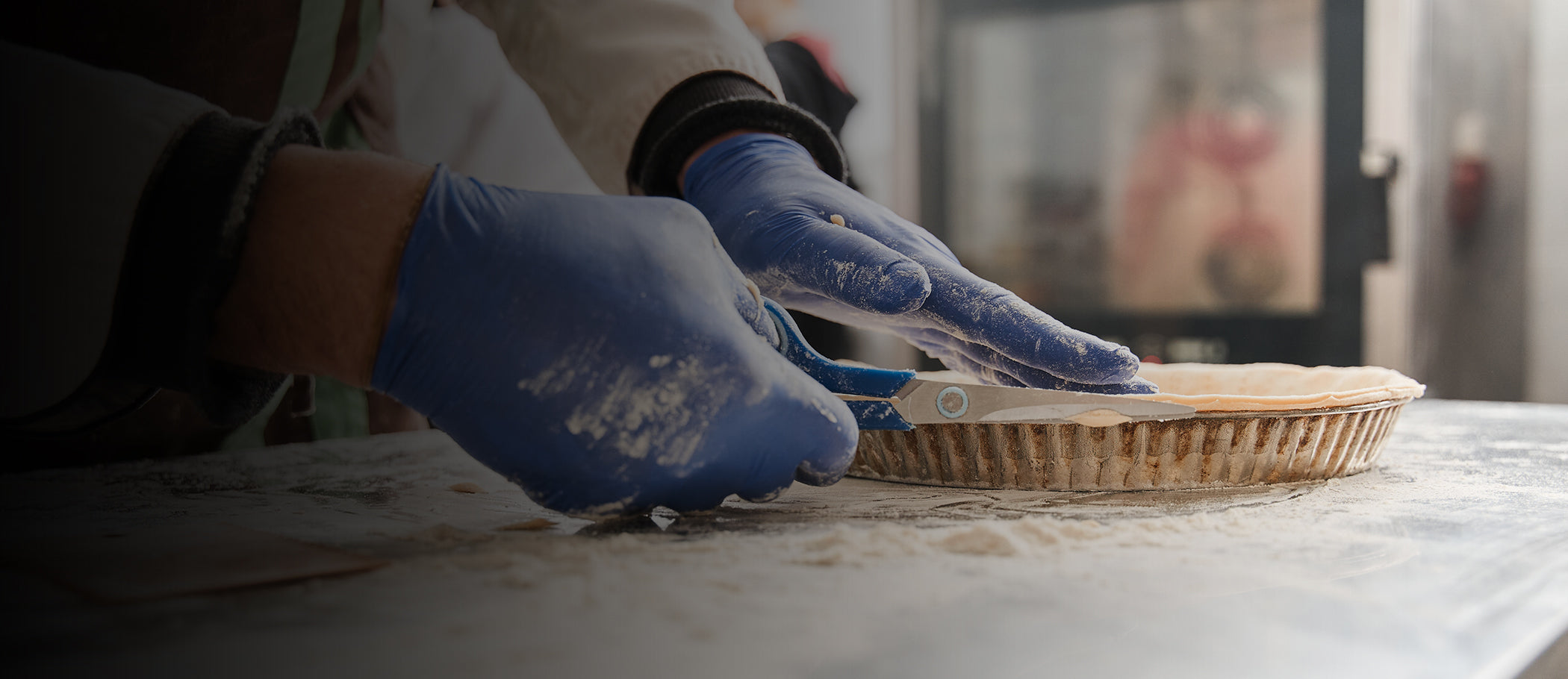 Food industry professional wearing American-made nitrile gloves for safe food handling