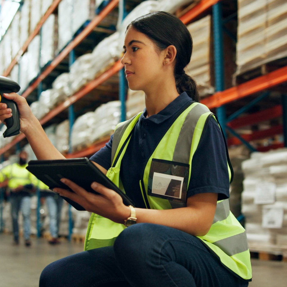 scanning ppe products in a warehouse full of ppe
